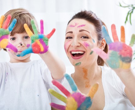 Happy family with colorful hands